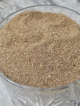 Load image into Gallery viewer, A close-up of frass, insect excrement, shown clean in a bowl. Meta: Frass is the waste produced by insects such as mealworms, often used as fertilizer in gardening. It consists of digested food particles and other waste materials. Insect frass can be a valuable nutrient source for plants, providing essential elements like nitrogen, phosphorus, and potassium. When used as a natural fertilizer, frass promotes healthy plant growth and soil enrichment.